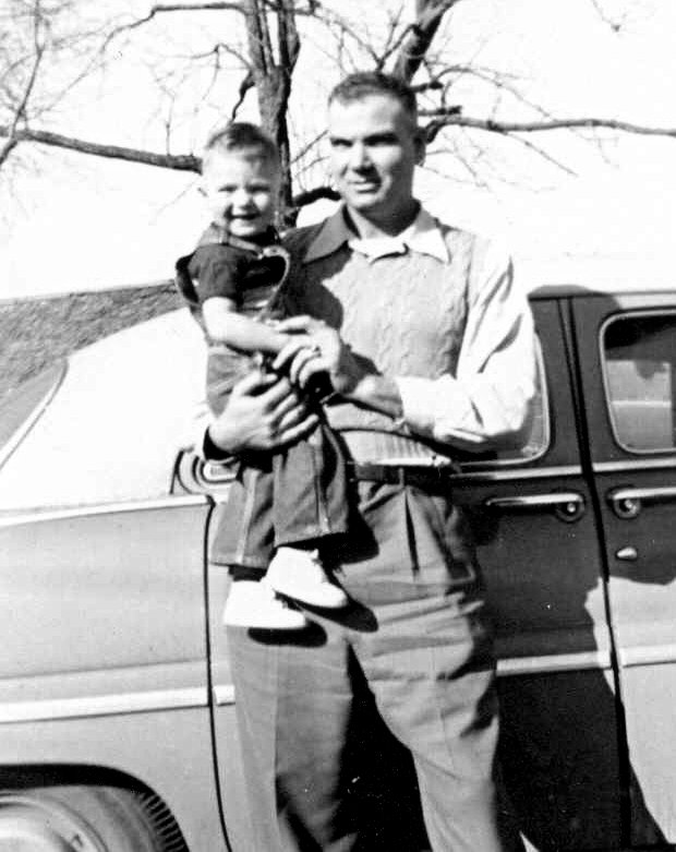 Ira Attebery holding Roger Baxter