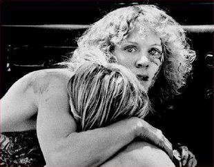 Dianne Wick comforting her nephew shortly after seeing his mother shot in the throat while watching the start of the Battle of the Flowers Parade in San Antonio, Texas, on April 27, 1979.