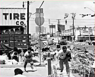 Chaotic street scene during the real life gun battle at Battle of the Flowers Parade in San Antonio, Texas, on April 27, 1979.